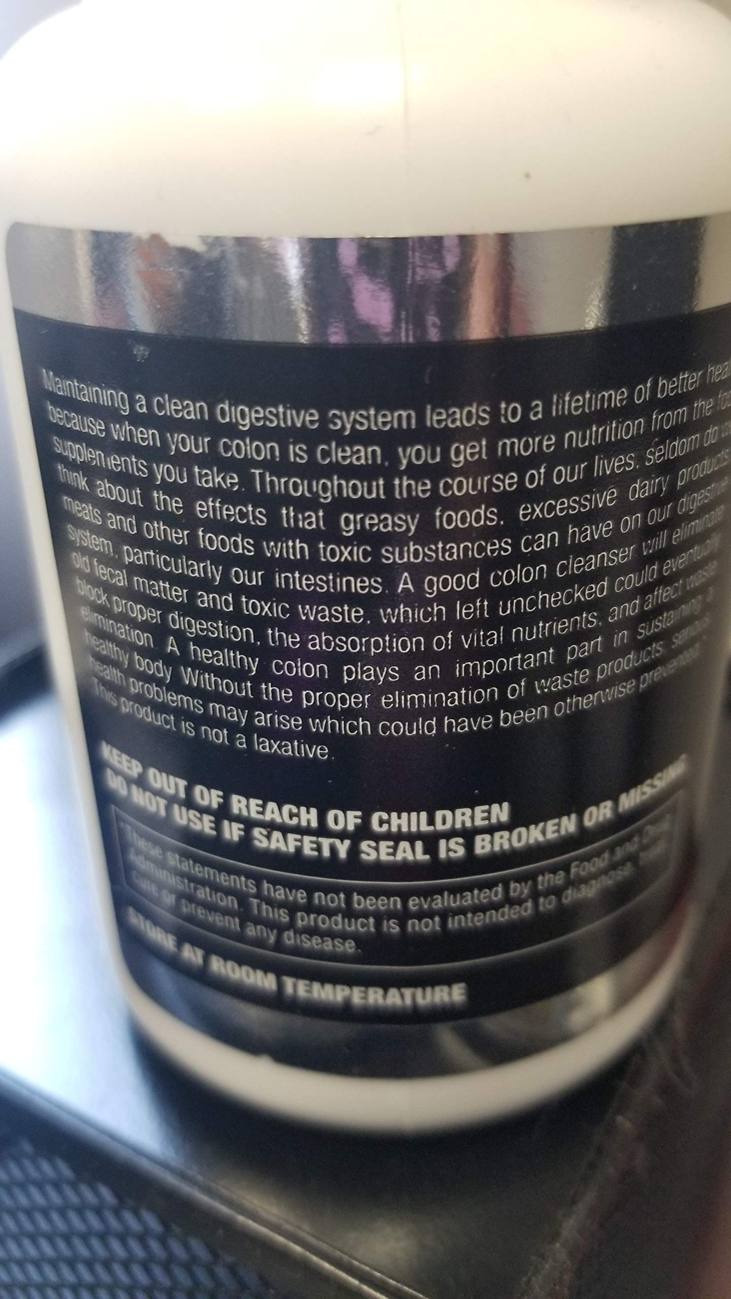 Lifestyle shot: Vita Plus Colonex bottle with health-themed background