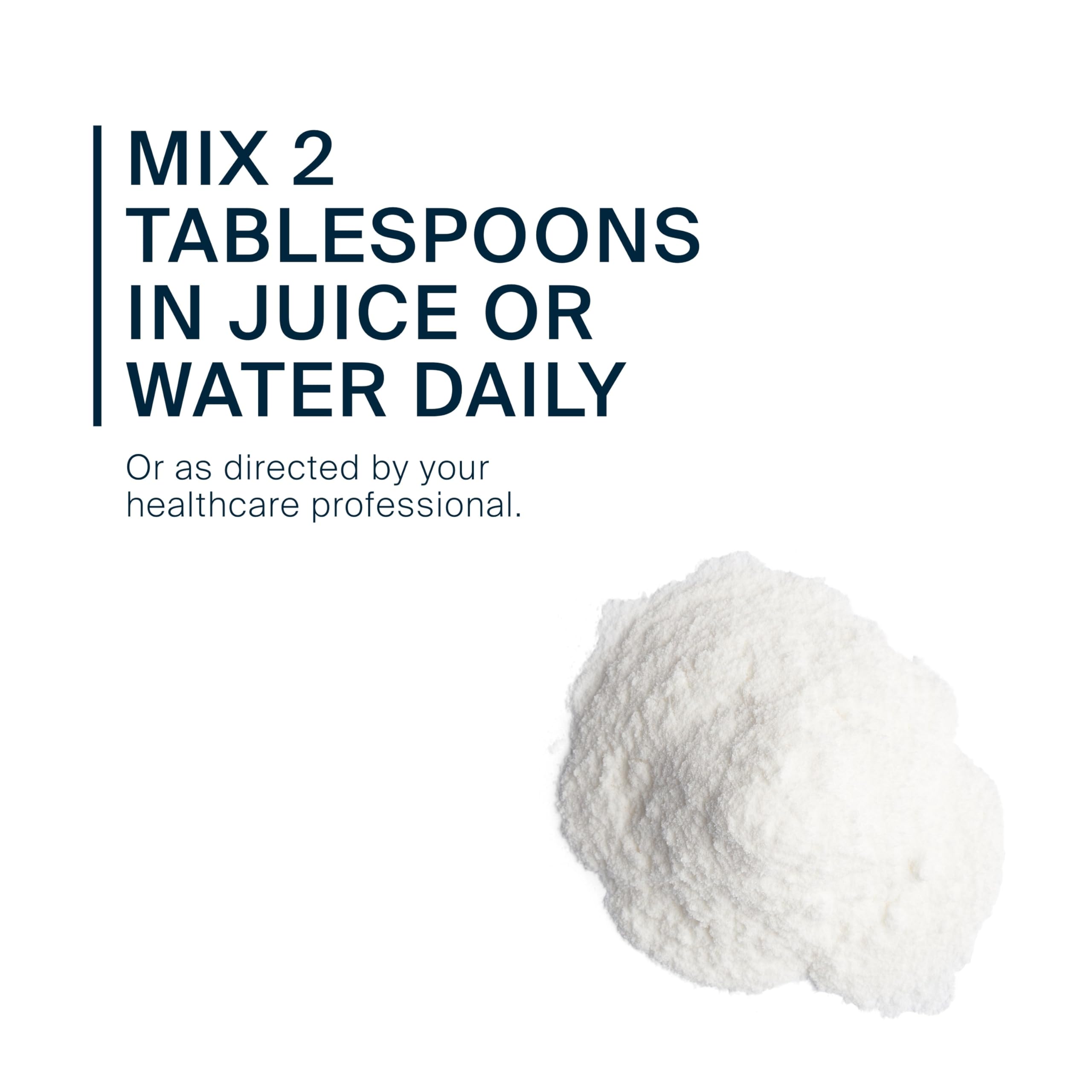 Scoop of cellulose fiber powder being poured