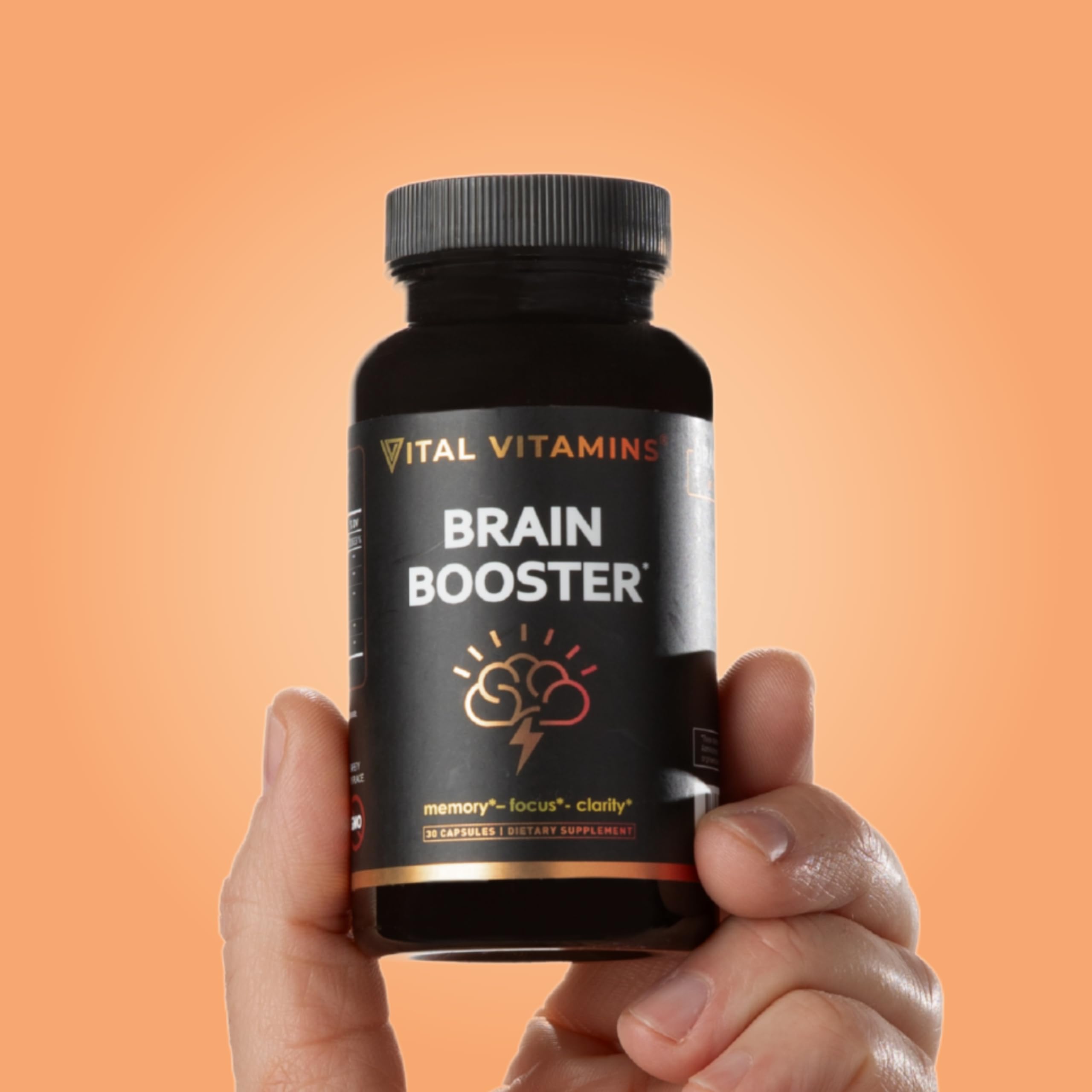 Person studying with brain-boosting capsules nearby.