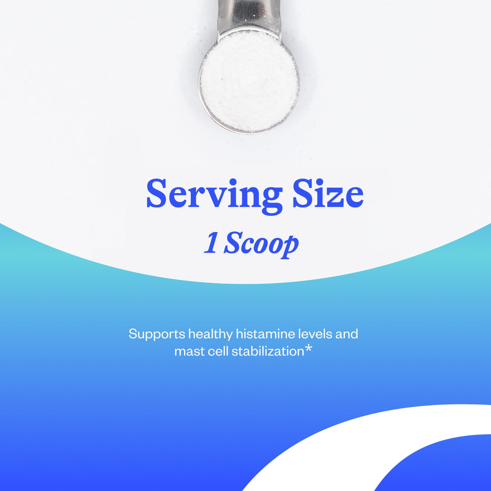 Scoop of buffered vitamin C powder in glass scoop