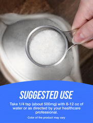 Vitamin E powder being mixed into a beverage or shake