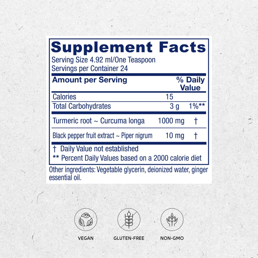 Close-up of golden turmeric liquid in a dropper