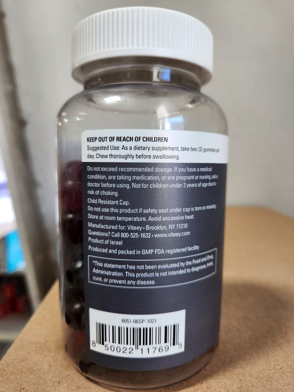 Bottle beside a glass of water