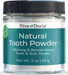 Viva Doria natural tooth powder in a clear glass jar
