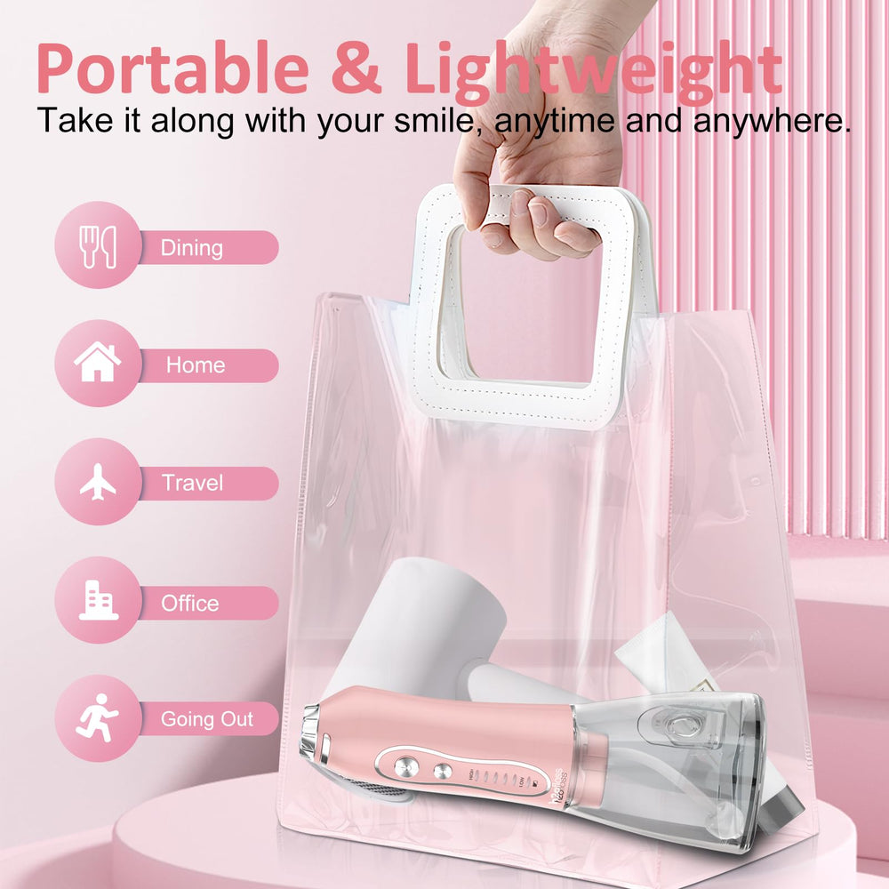 Travel-ready pink water flosser with charging indicator