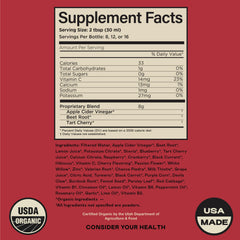 Glass of water with the uric acid liquid supplement