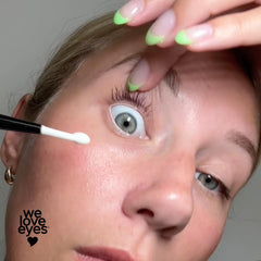 Brush in use for eyelid cleansing with cleansing oil