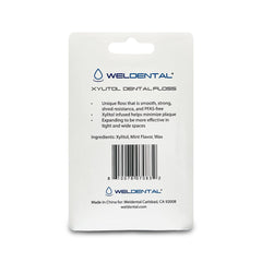 Mint-flavored Xylitol dental floss 50m coil close-up