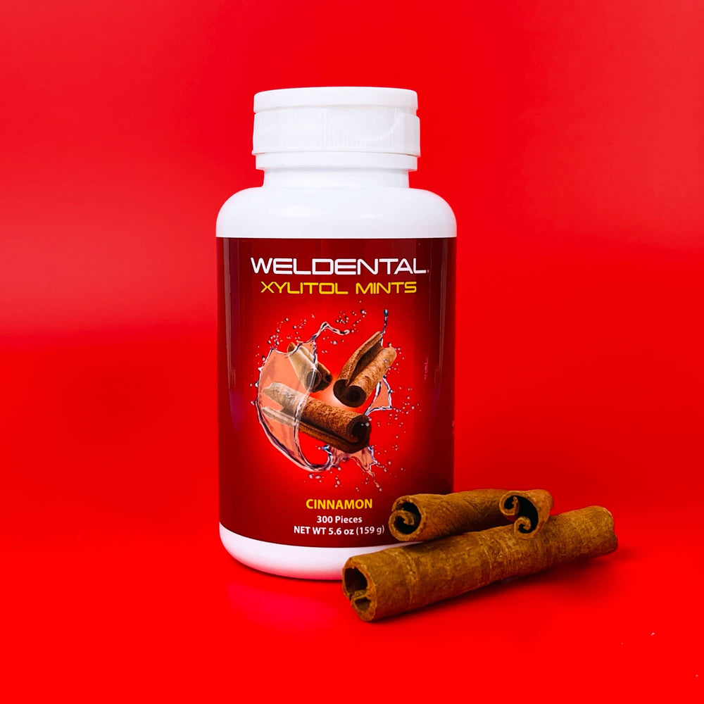 Close-up of cinnamon-flavored WELdental Xylitol Mints