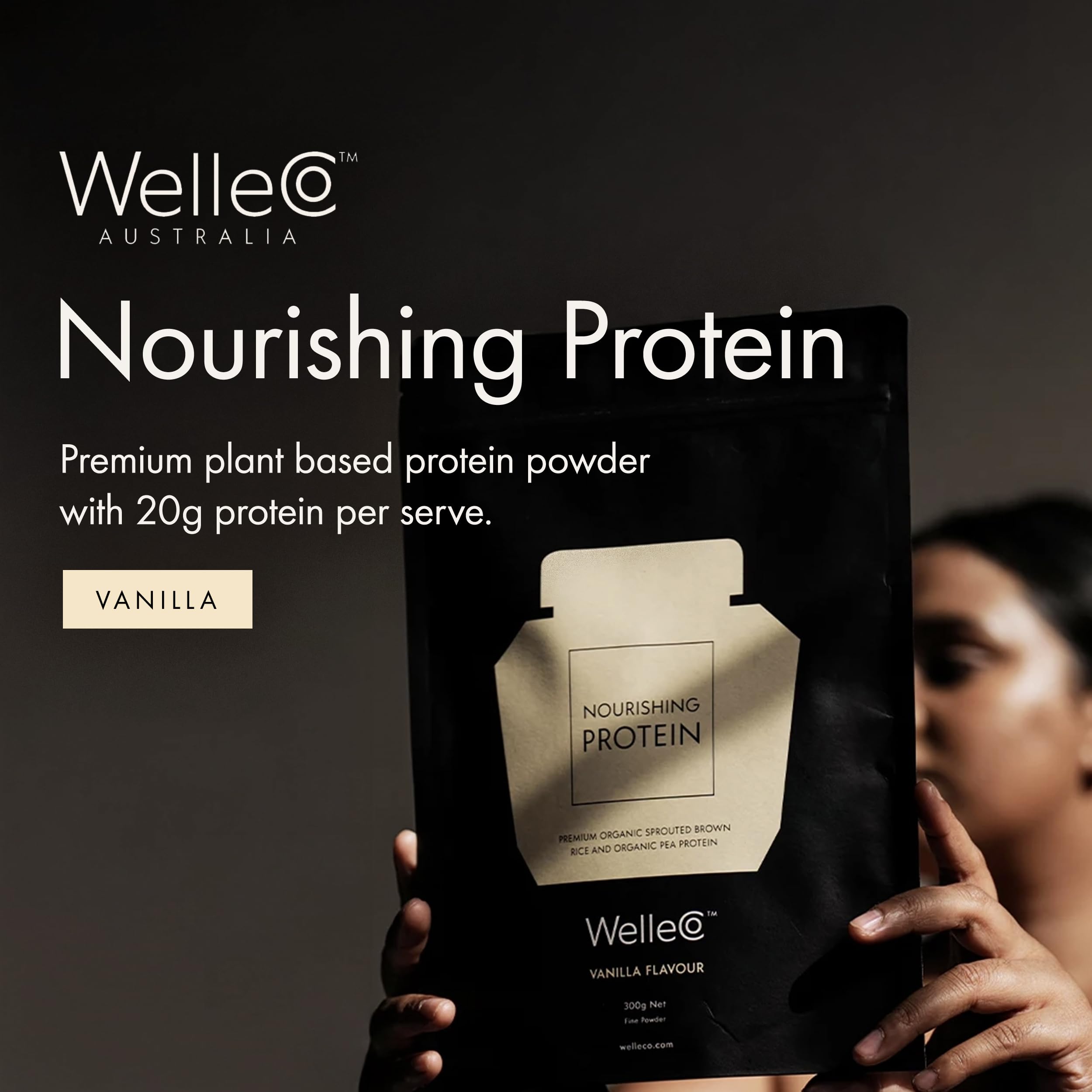 WelleCo vanilla protein powder stirred with plant milk for a smooth shake.