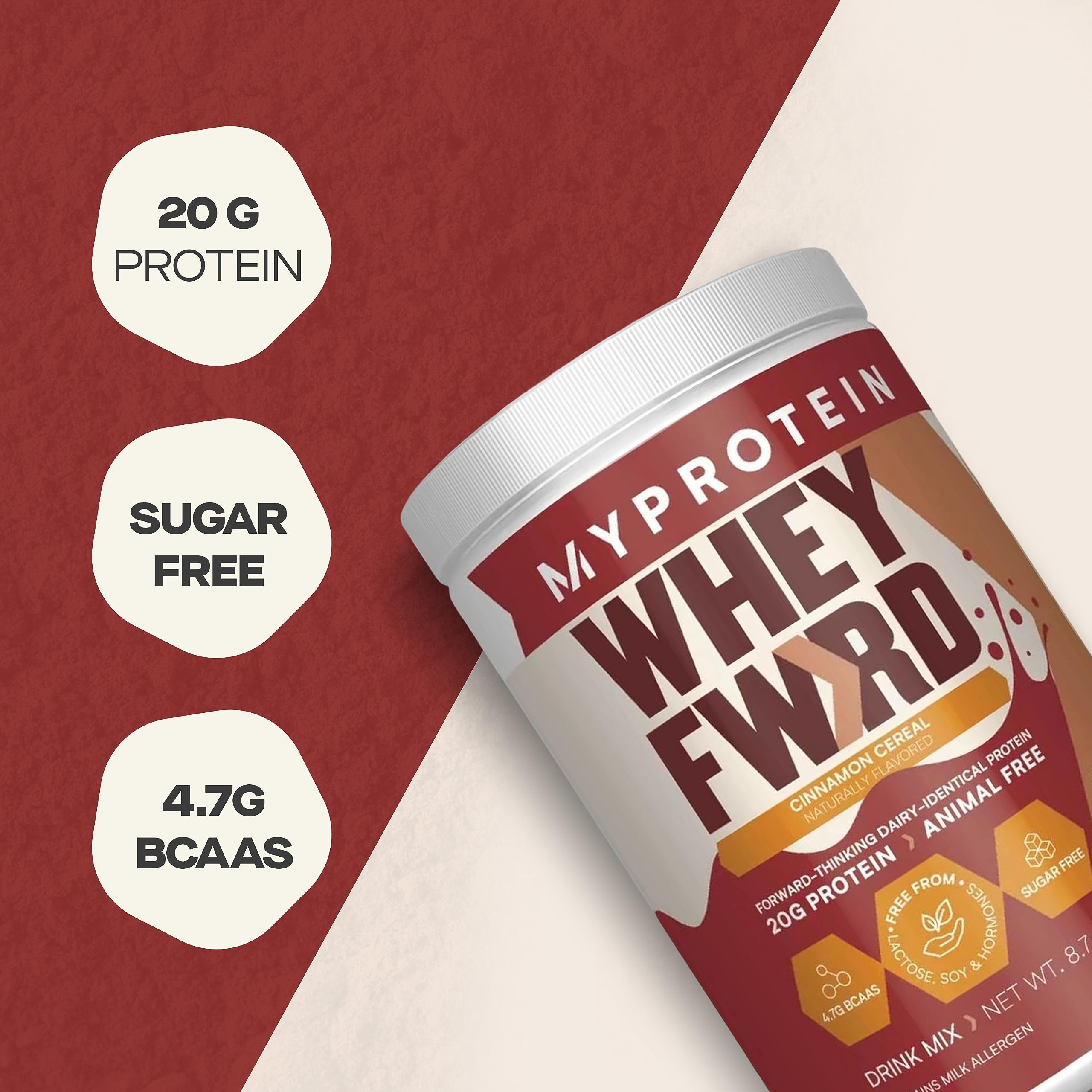 Scoop pouring protein powder into a glass for a shake