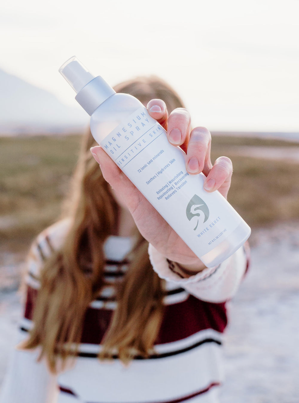 Spray application shot of White Egret Magnesium Oil Spray