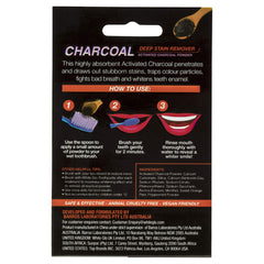Applying charcoal whitening powder to a toothbrush