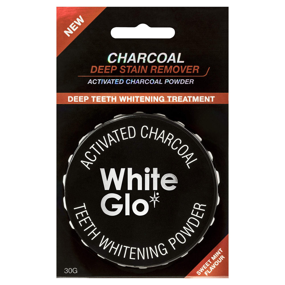 Close-up of White Glo charcoal teeth whitening powder tub