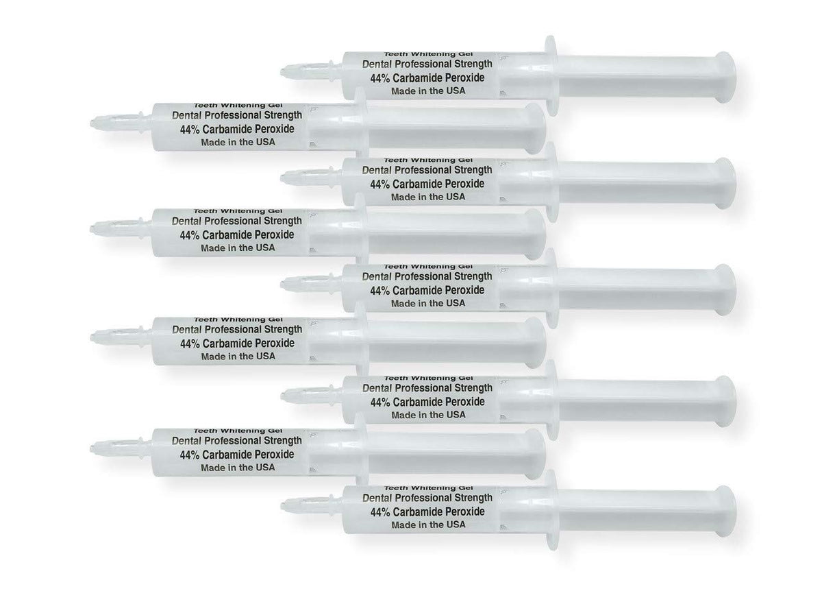 Close-up of White Teeth Global 44% carbamide peroxide whitening gel syringe (1 of 2).