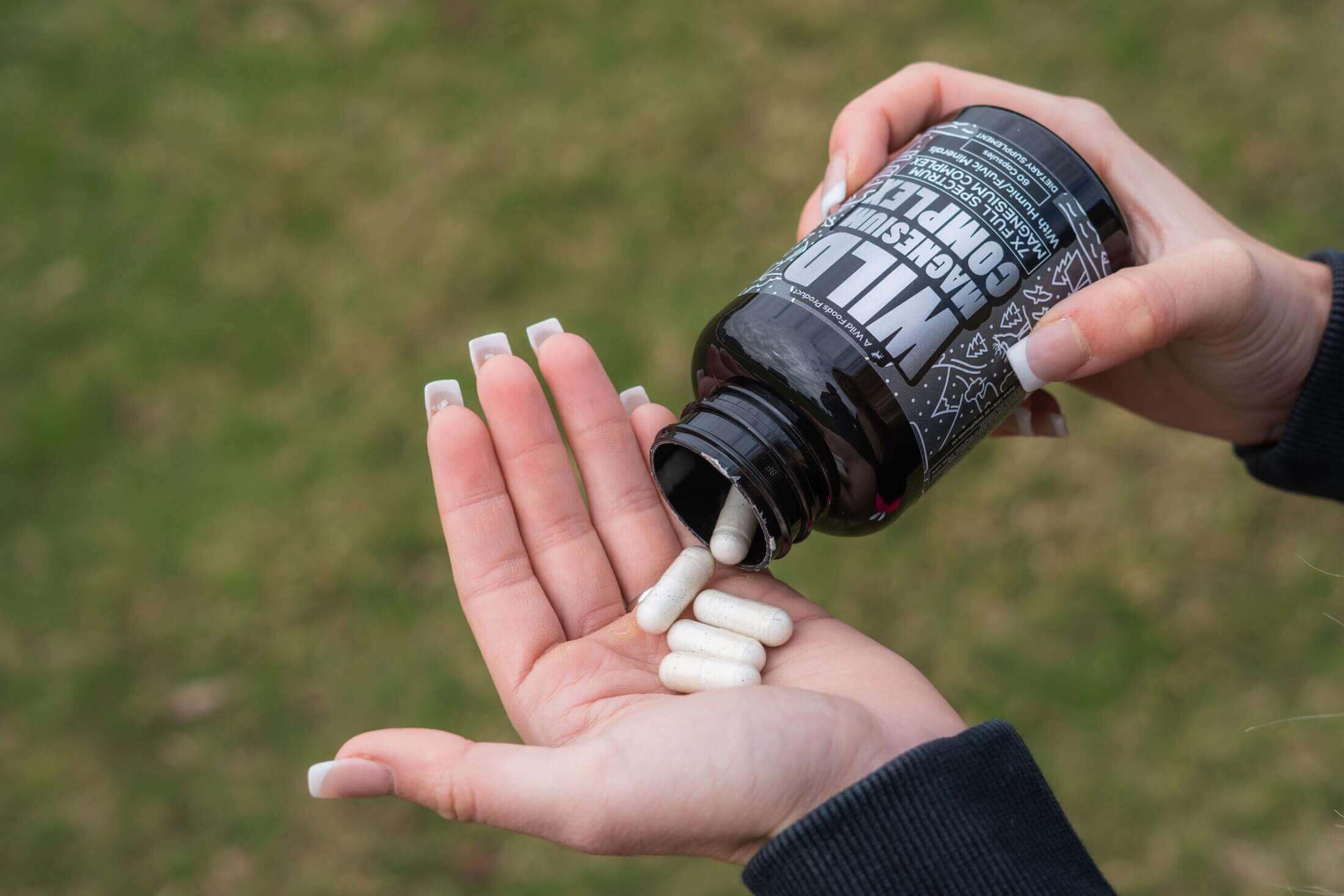 Flat lay of magnesium complex packaging with capsules