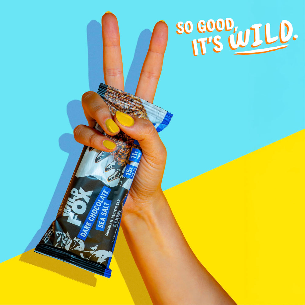 Wild Fox Protein Bars packaging shot highlights flavor options Cinnamon Churro, Dark Chocolate Sea Salt, Caramel Sea Salt.