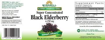 Close-up of the black elderberry liquid with a 1 teaspoon serving