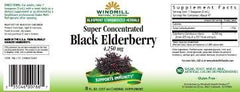 Close-up of the black elderberry liquid with a 1 teaspoon serving
