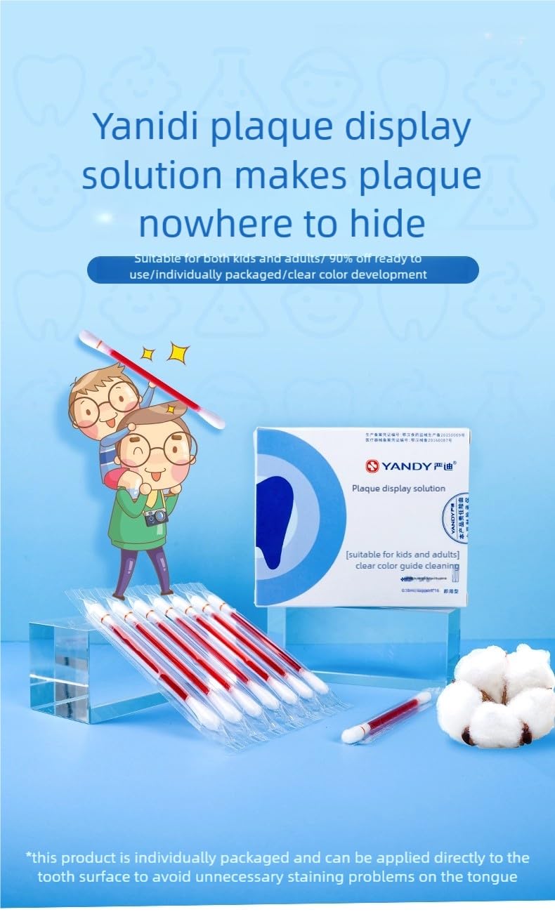 Close-up of plaque disclosing tablets staining teeth in bright red