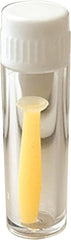 Yellow soft silicone contact lens tool plunger remover close-up on lens