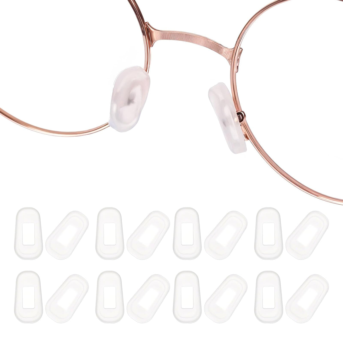 Transparent white silicone eyeglass nose pads displayed on a white background