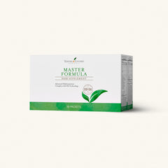 Close-up of capsules with the Master Formula bottle