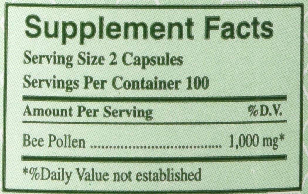 Close-up view of YS Organics Bee Pollen capsules in a pack of 2
