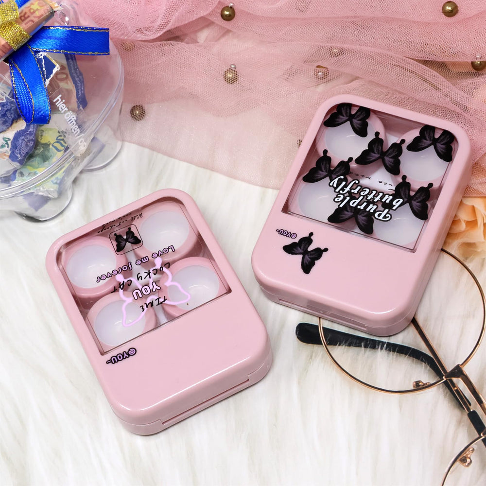 Close-up of two pink butterfly contact lens cases