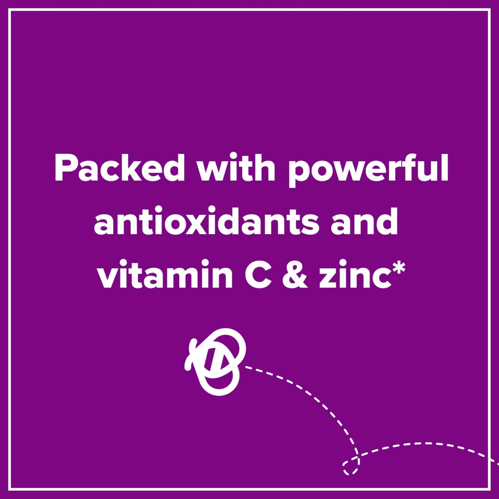 Pouring Zarbee's elderberry immune support into a spoon