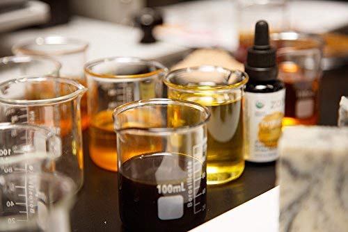 Close-up of Nigella sativa and turmeric extracts in oil blend