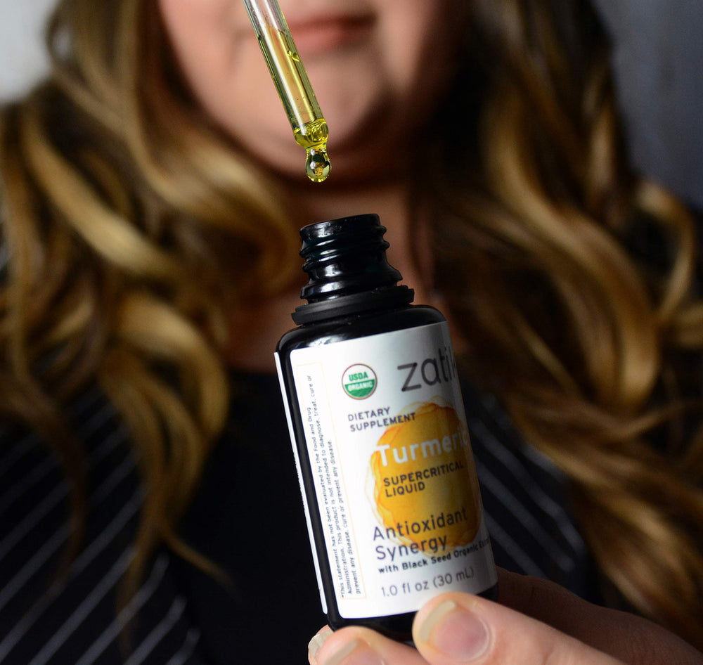 Ingredients label showing organic black cumin oil and turmeric extract