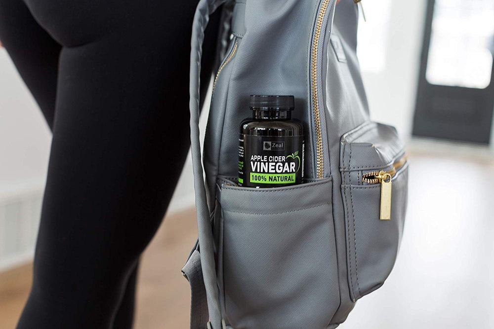 Zeal Naturals ACV capsules on a breakfast tray suggesting daily routine.