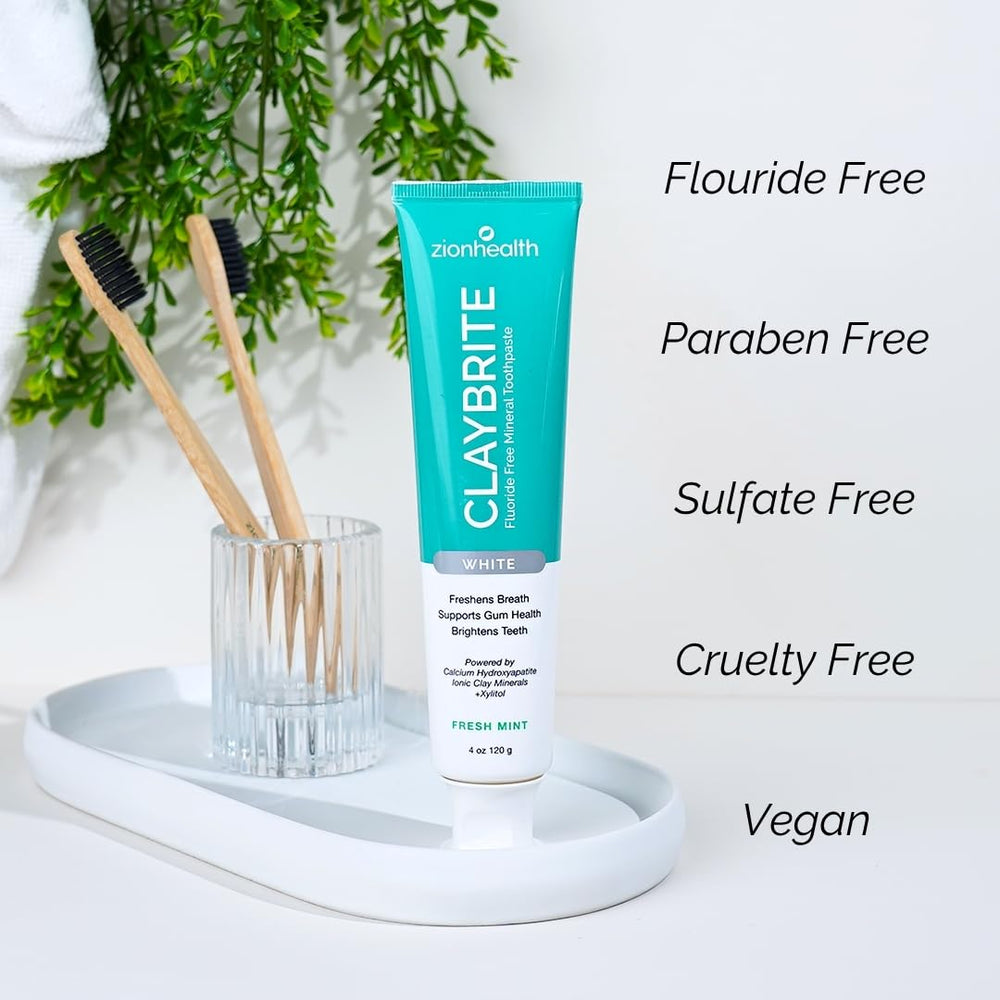 Toothpaste on toothbrush showing mint flavor