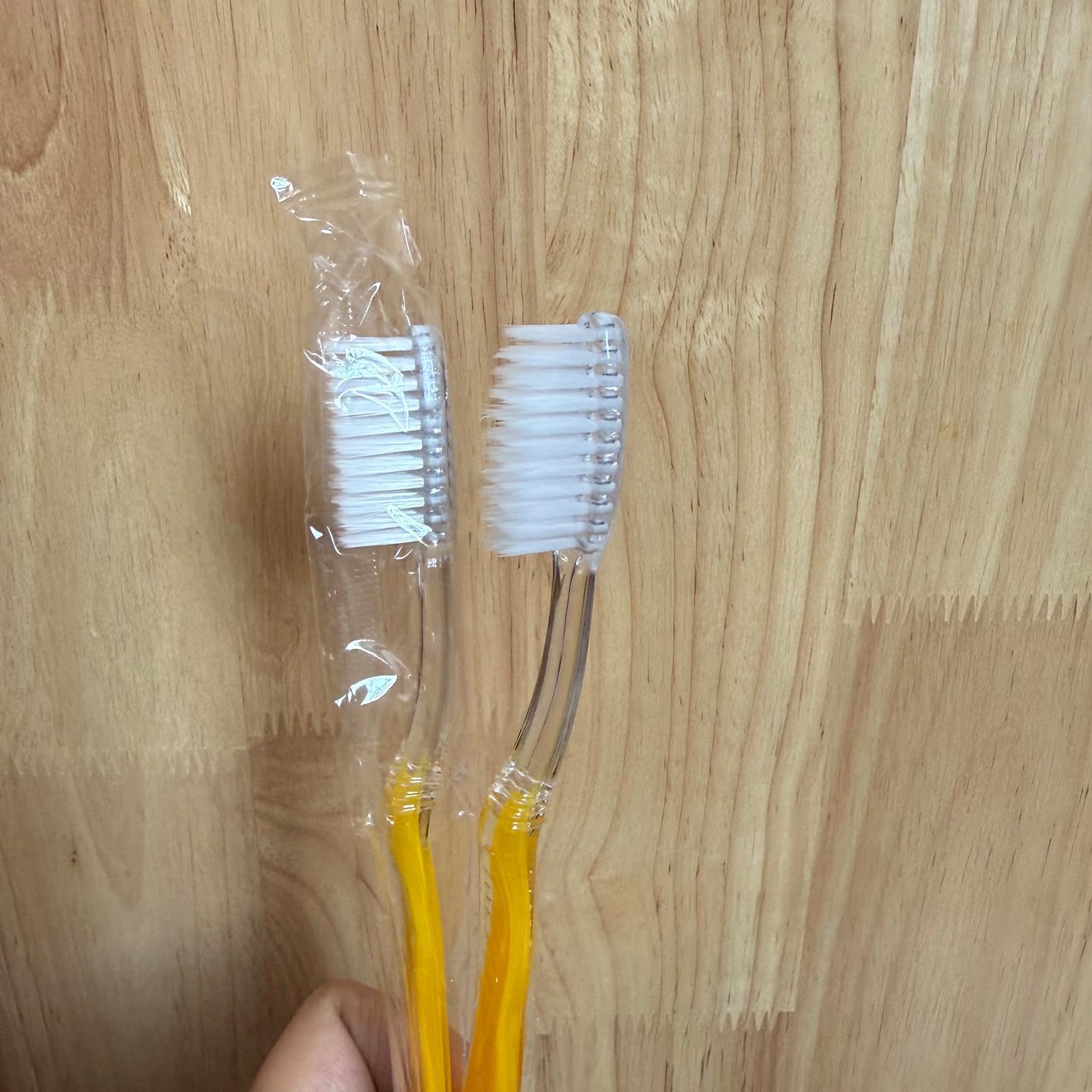 Toothbrush showing 7.25 inch length and medium solid handle