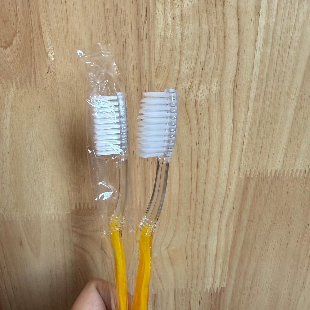 Toothbrush showing 7.25 inch length and medium solid handle